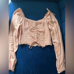 Pink/peach long sleeve ruched crop top. Never worn, size medium